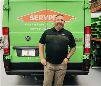 Man in front of SERVPRO van smiling for photo.